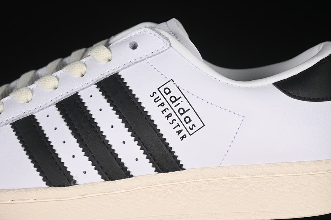 Close-up of the Adidas Superstar side stripes and branding