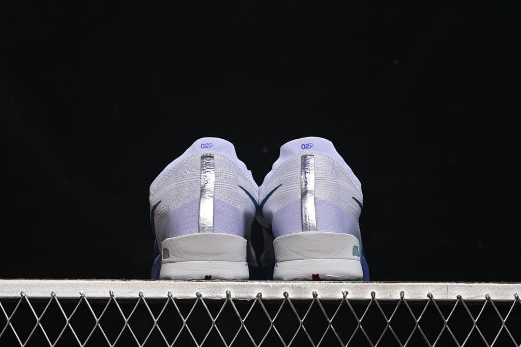 Rear view of both shoes showing the heel details.
