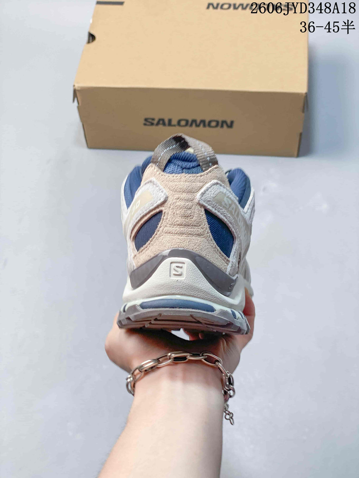 Rear view of a blue and off-white Salomon XT-3D shoe