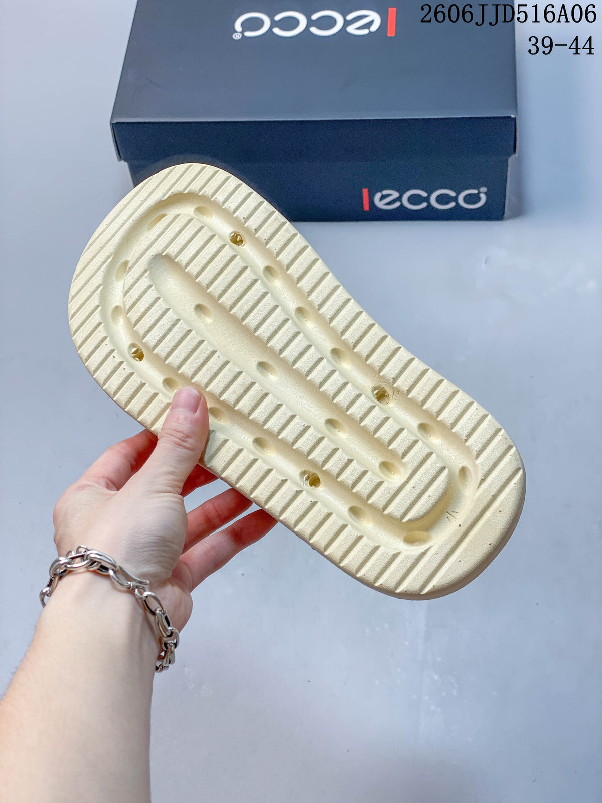 Close-up of the cream outsole with the branded shoe box in the background.