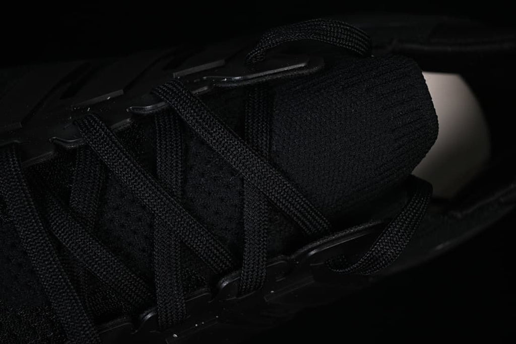 Close-up of the black laces and knit-look upper.