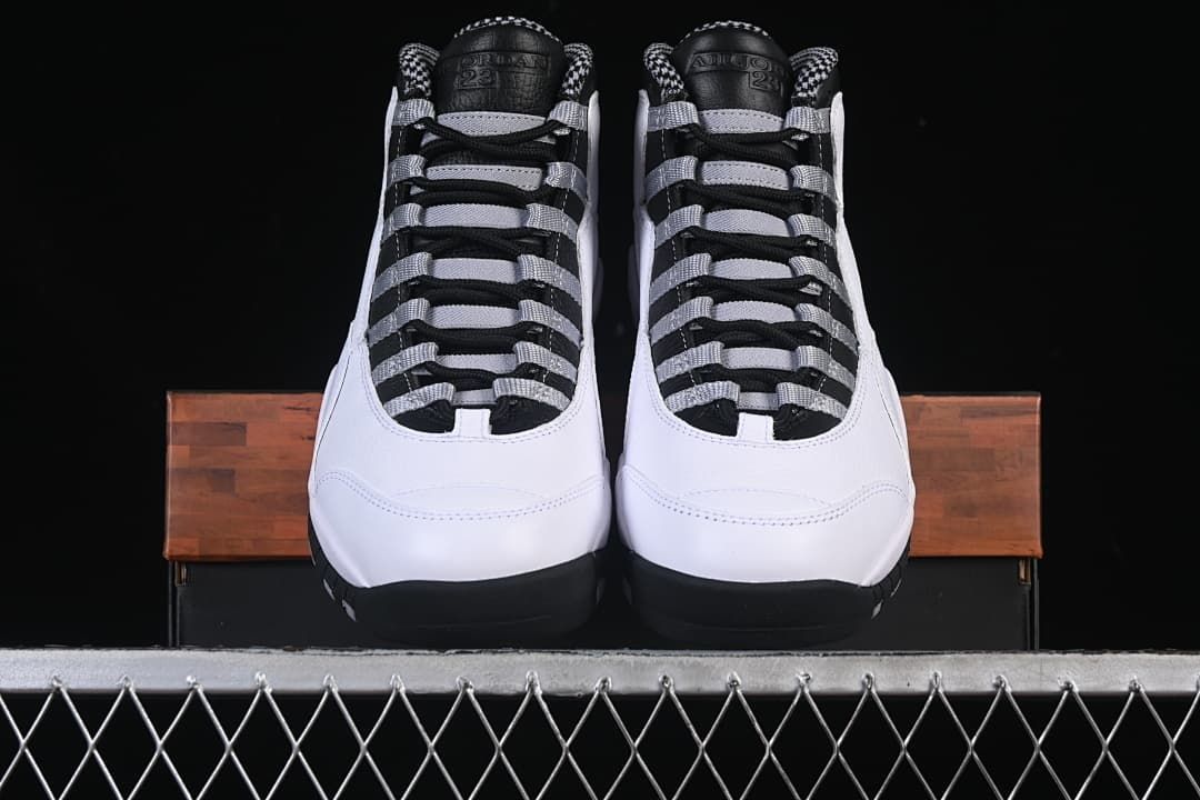 Front view of the pair showing their high-top shape and contrasting laces