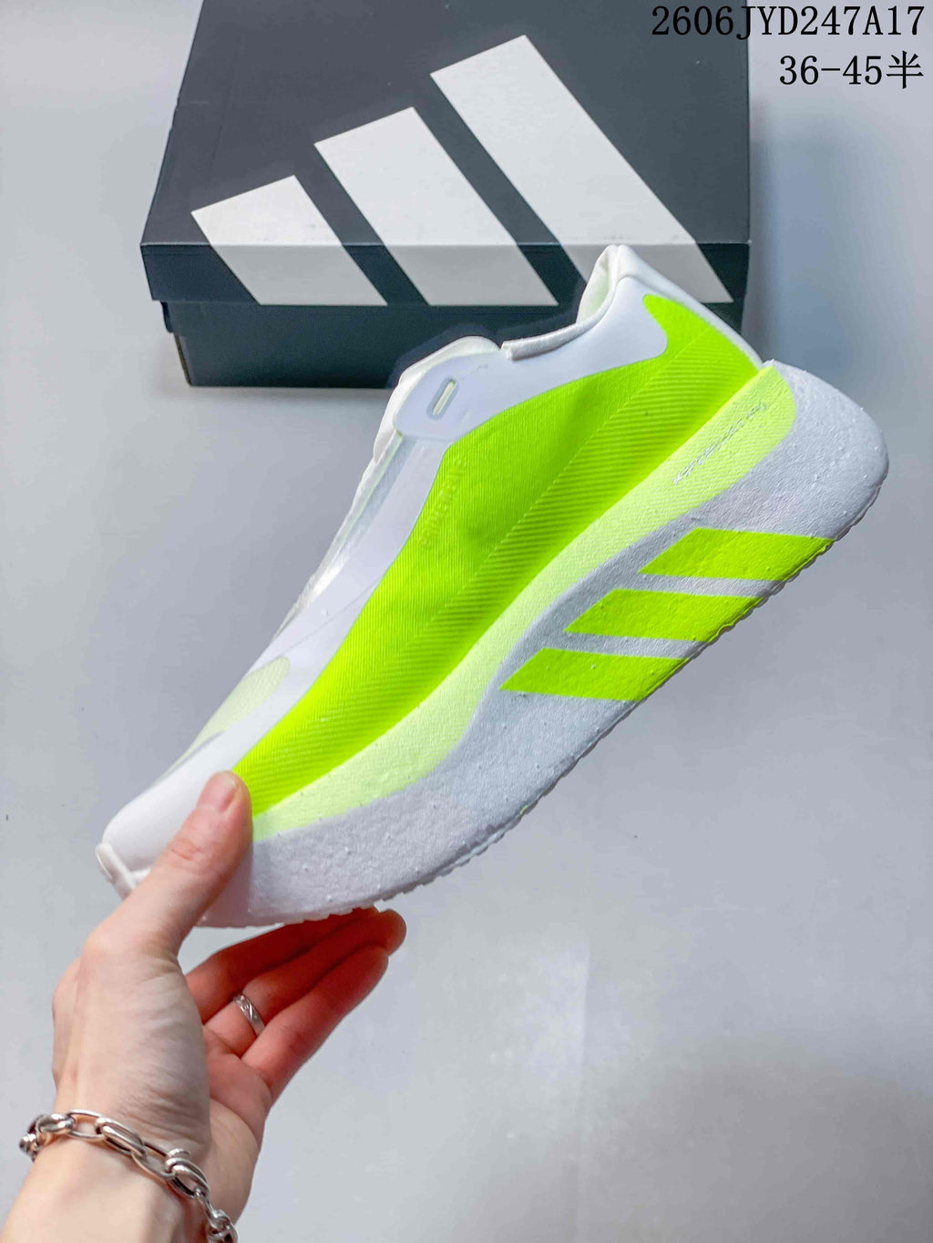 Side view of the sneaker highlighting its neon-lime panels and sculpted sole