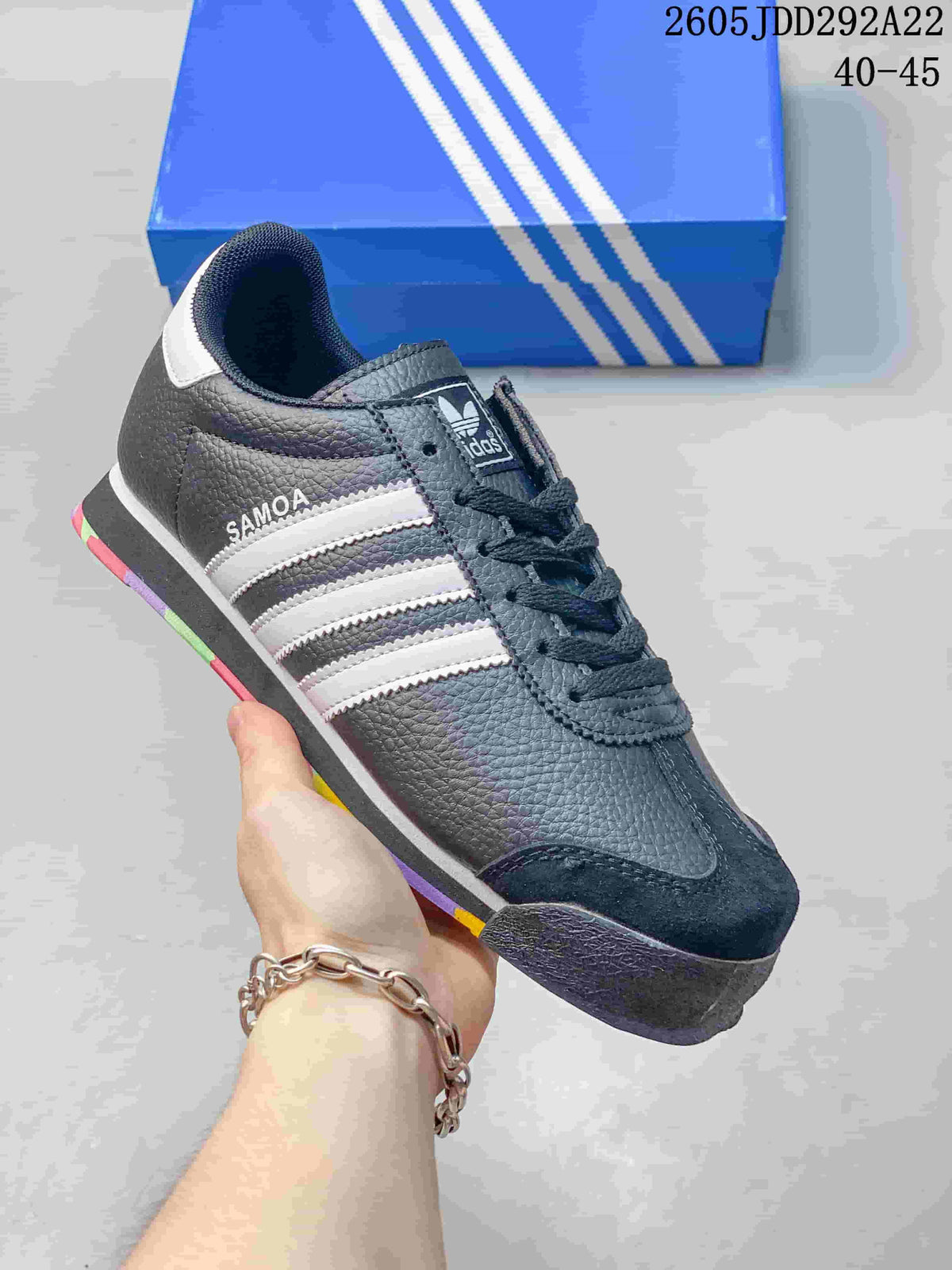 Dark gray Adidas Samoa low-top sneaker with white stripes