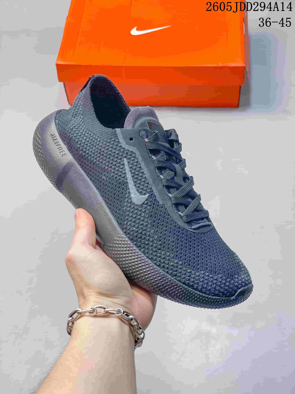 Angled close-up of the dark gray Nike Free shoe with side logo and flexible-looking sole