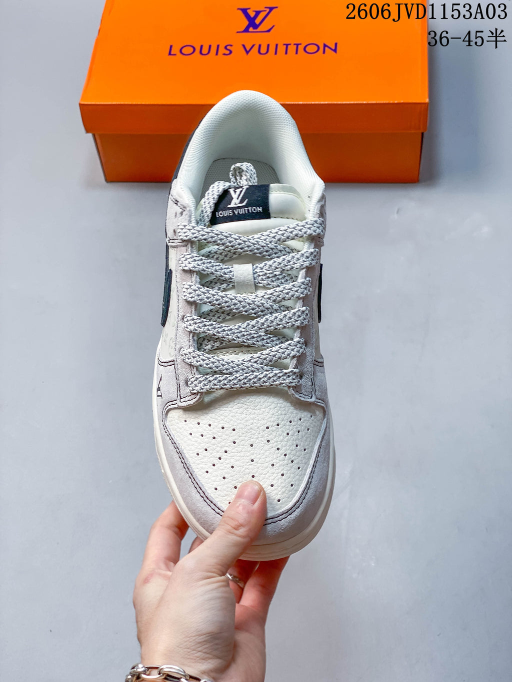 Top view of a sneaker showing its perforated toe, textured laces, and padded collar