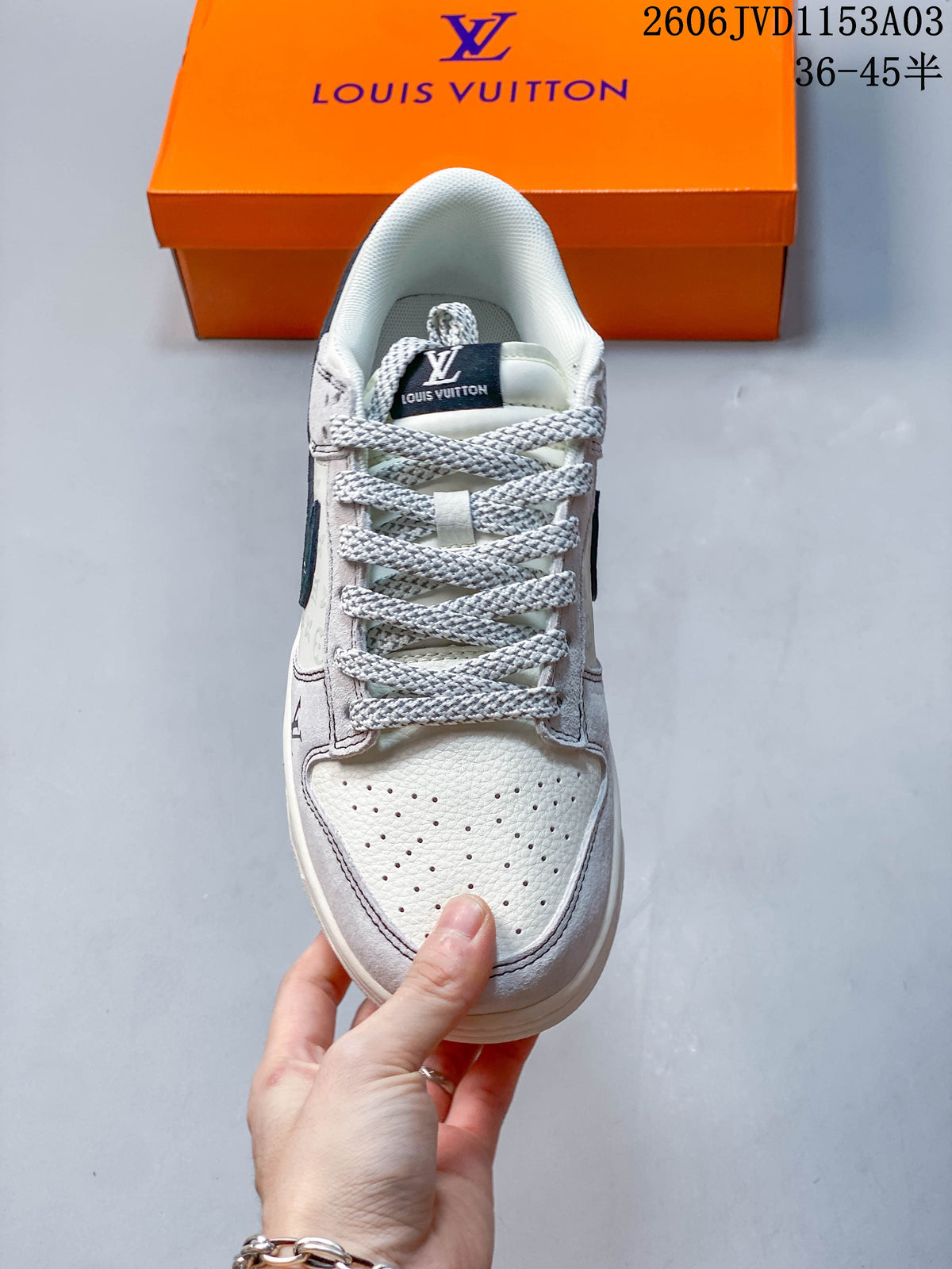 Top view of a sneaker showing its perforated toe, textured laces, and padded collar