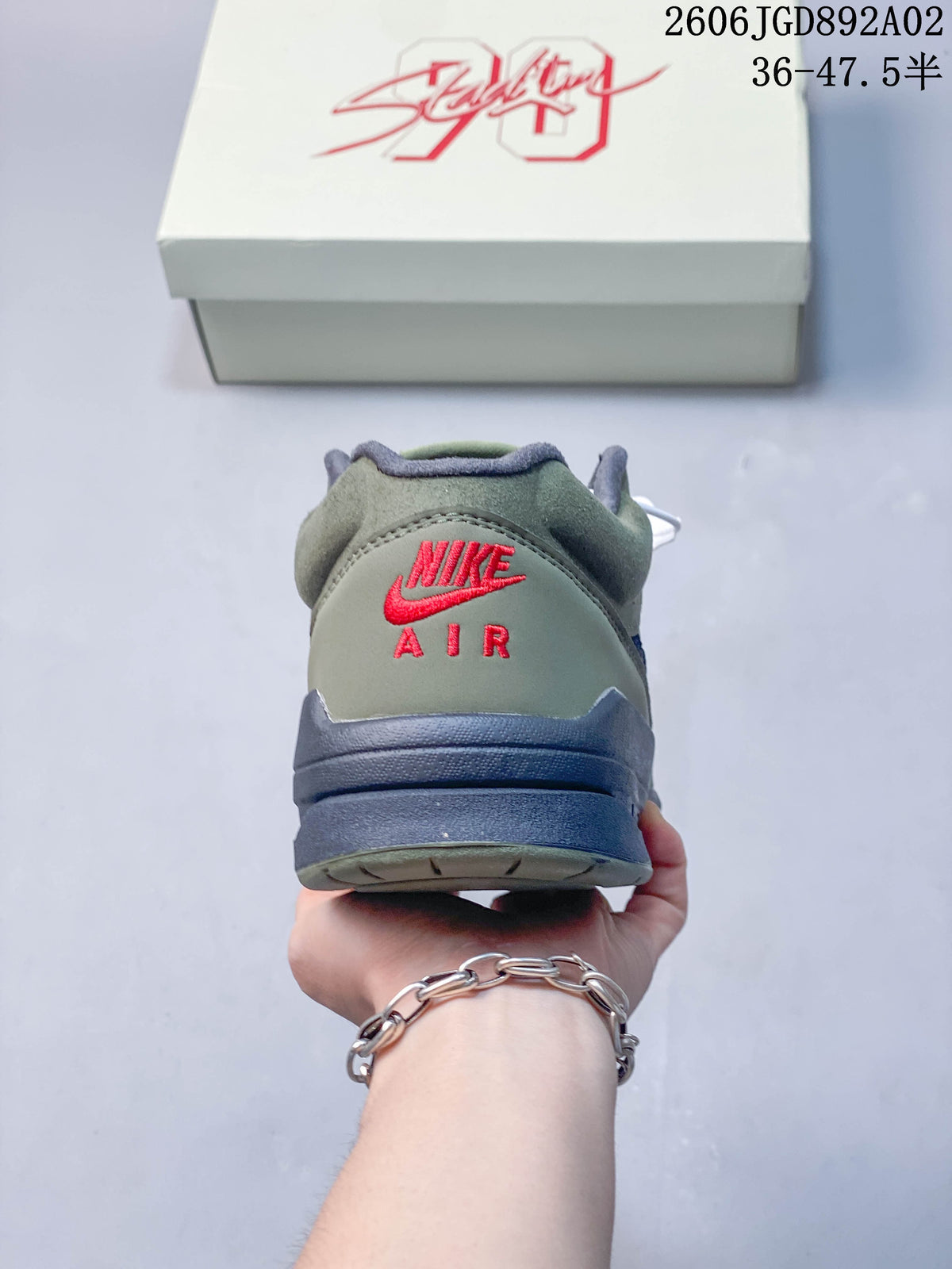 Rear view showing the heel branding and layered sole of a Jordan Stadium 90 sneaker.
