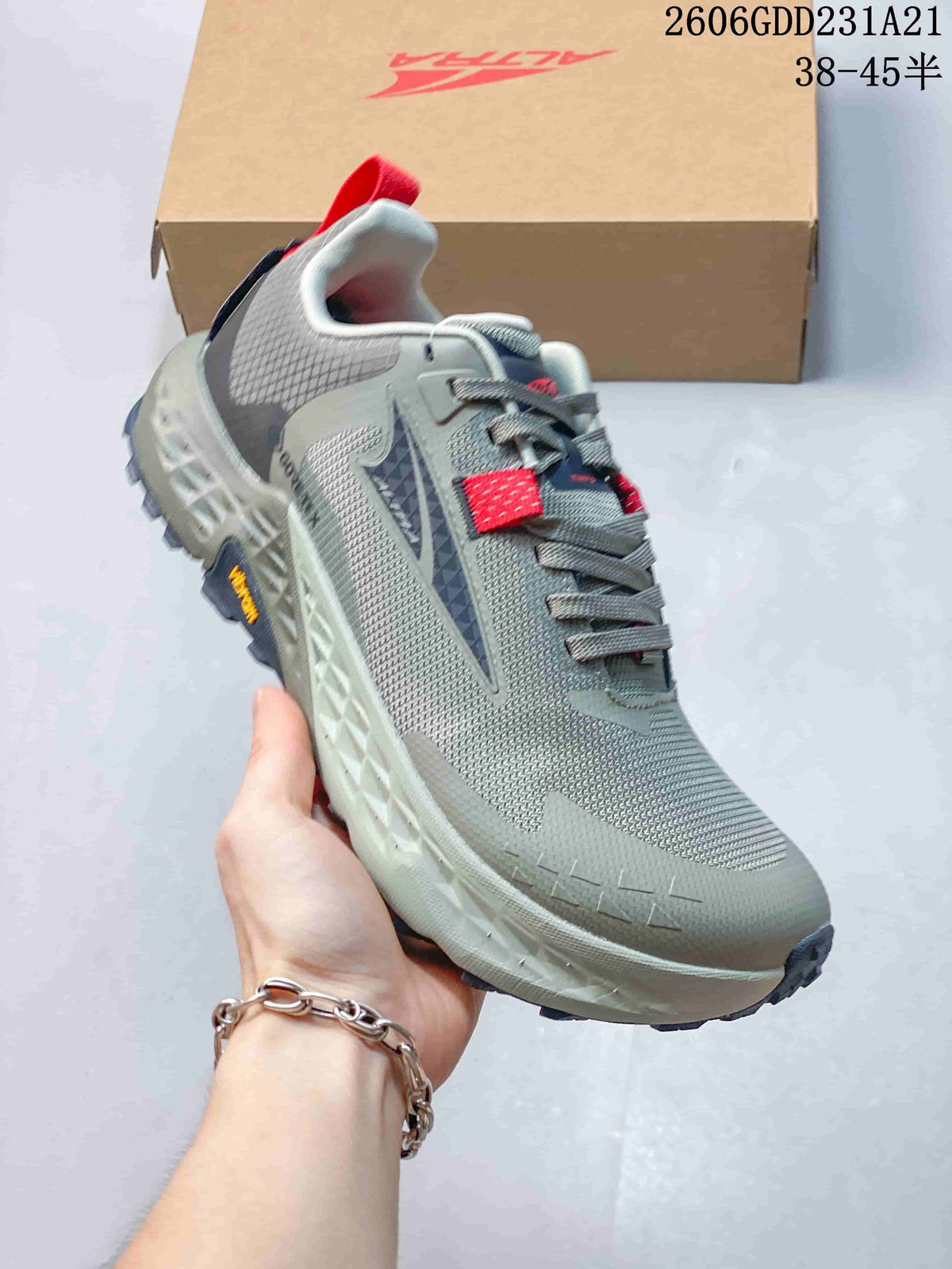 Angled side view highlighting the upper, midsole, and trail outsole