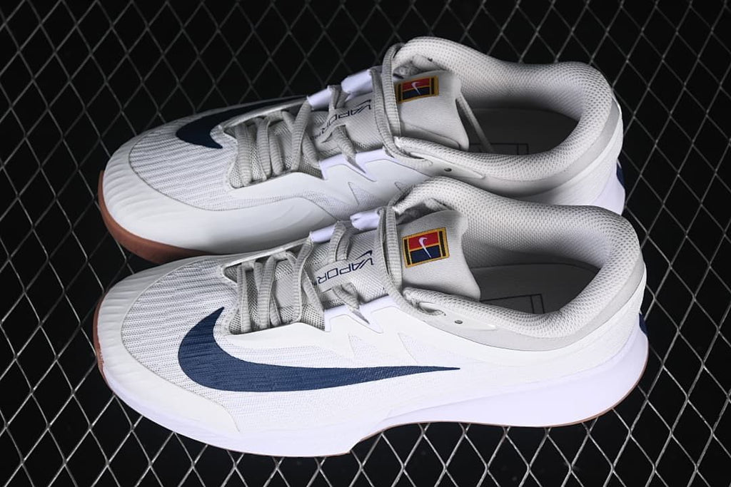 Pair of white and navy Nike Zoom Vapor Pro 3 shoes viewed from above.