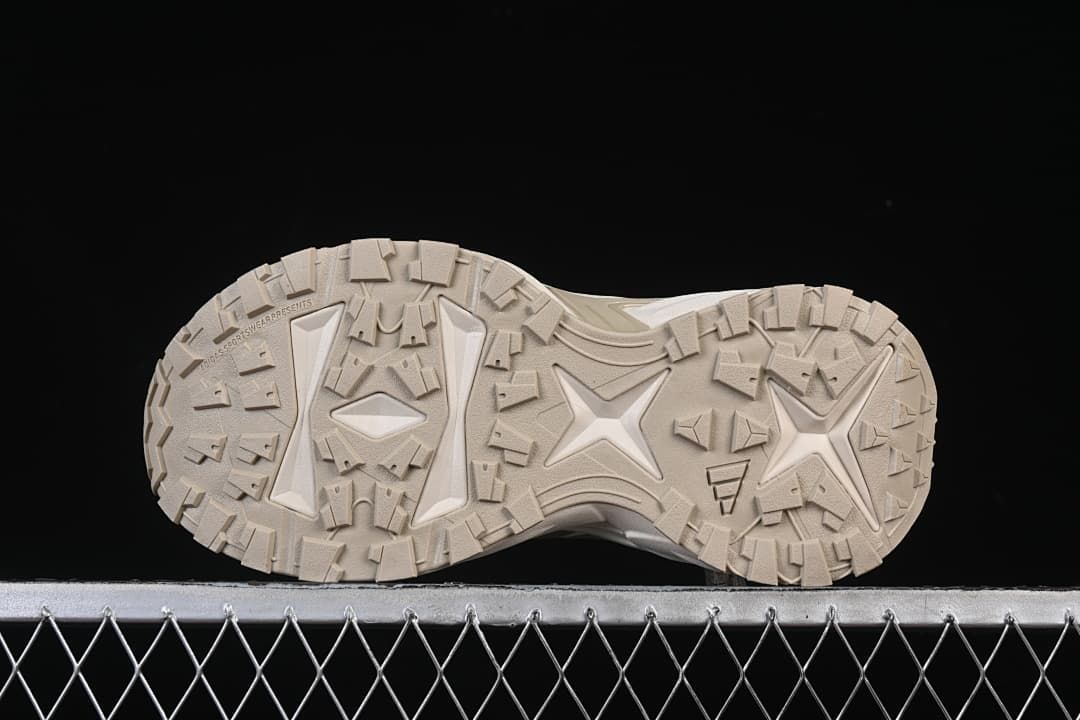 Underside view showing the patterned sneaker outsoles