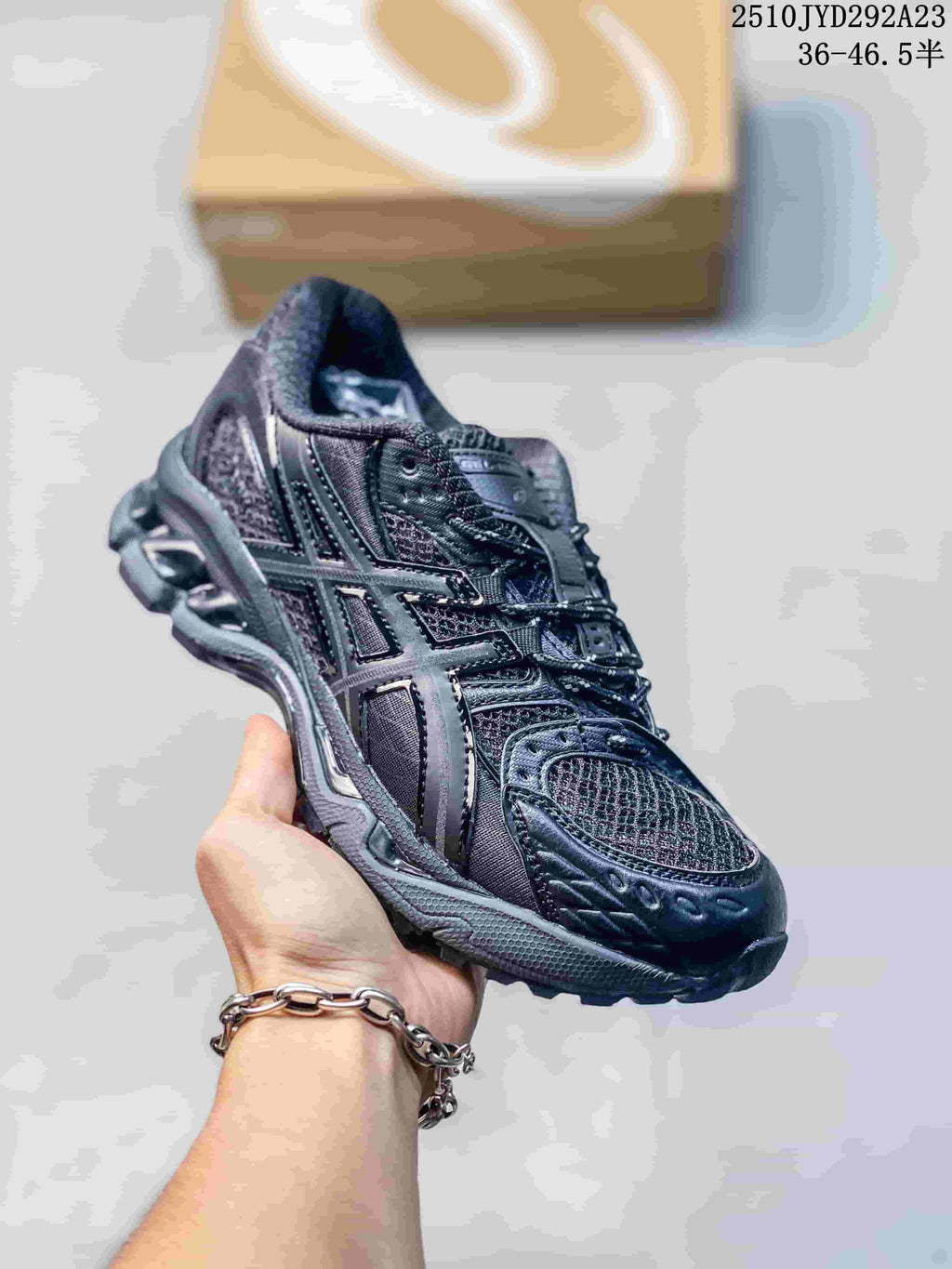 Dark charcoal ASICS Gel-Nimbus sneaker with tonal mesh and side stripes.