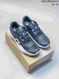 Pair of gray On The Roger Pro Fire tennis shoes with white and blue accents, shown from above and at an angle.