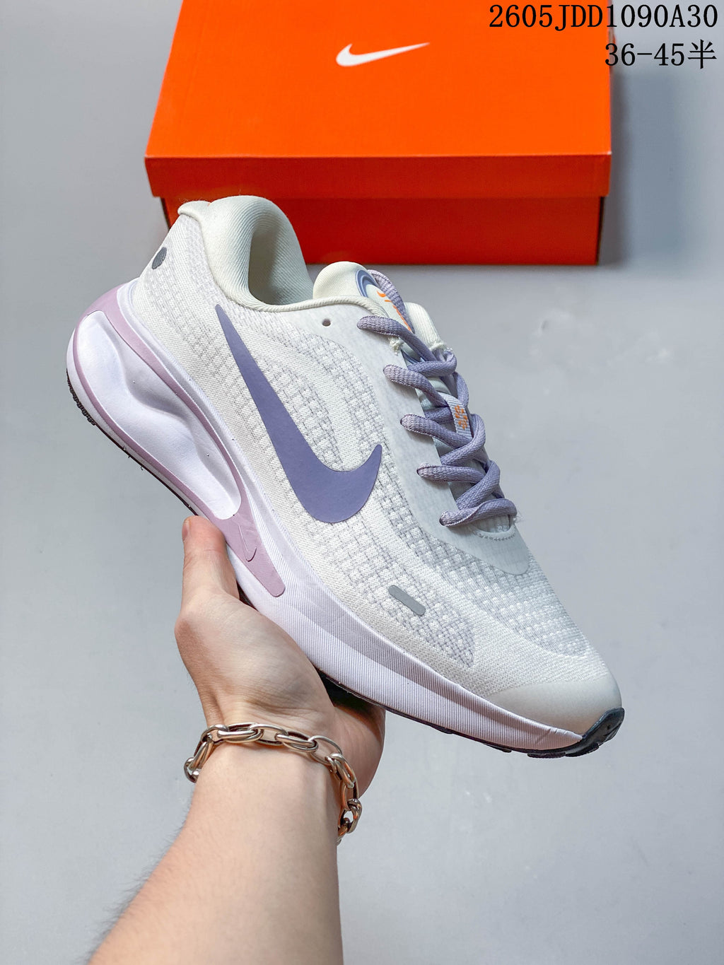 Nike Journey Run shoes in several color variations arranged in a circle.