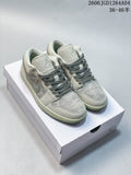 Pair of pale gray Air Jordan 1 Low sneakers with darker gray laces on a white box
