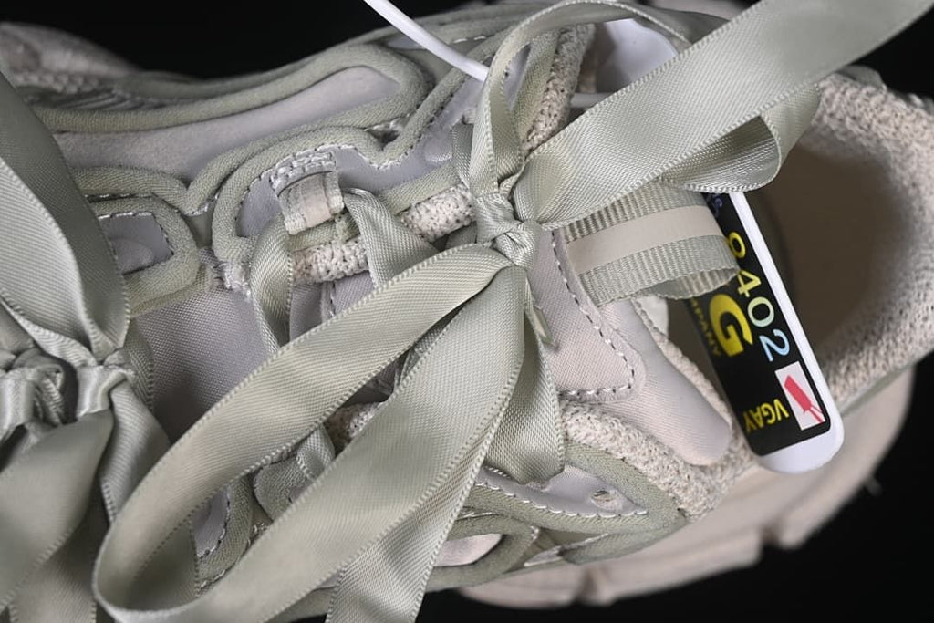 Close-up of ribbon laces and upper details