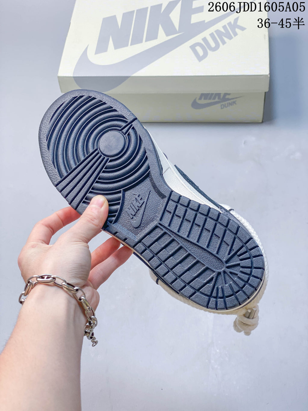 Close-up of the navy patterned outsole on a Nike SB Dunk Low sneaker