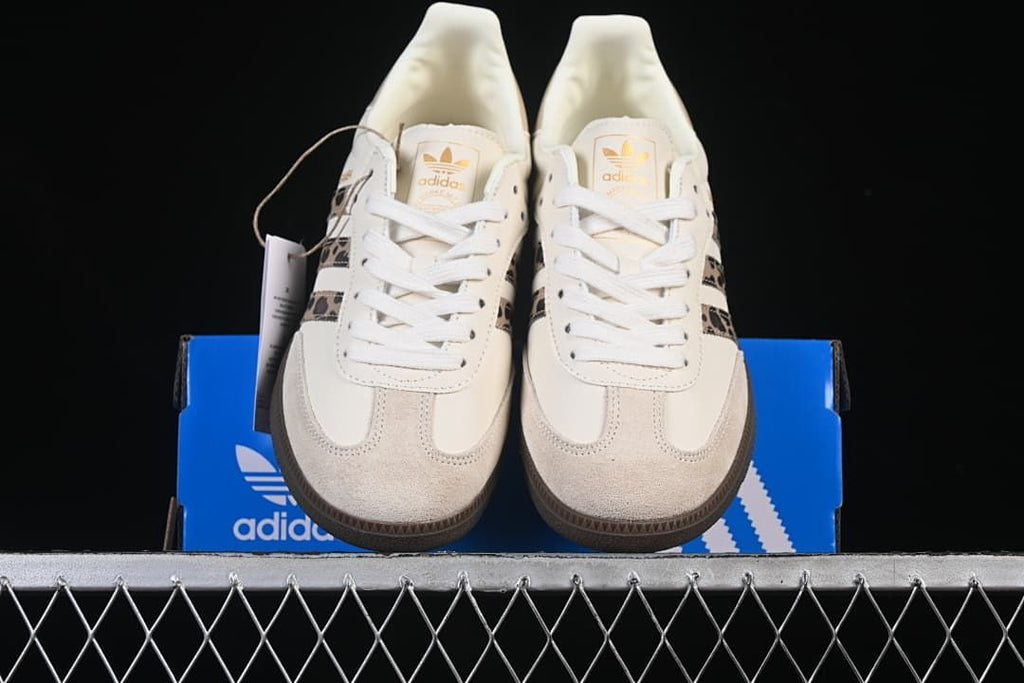 Front view of the pair showing the suede-look toe overlays and lace-up fronts