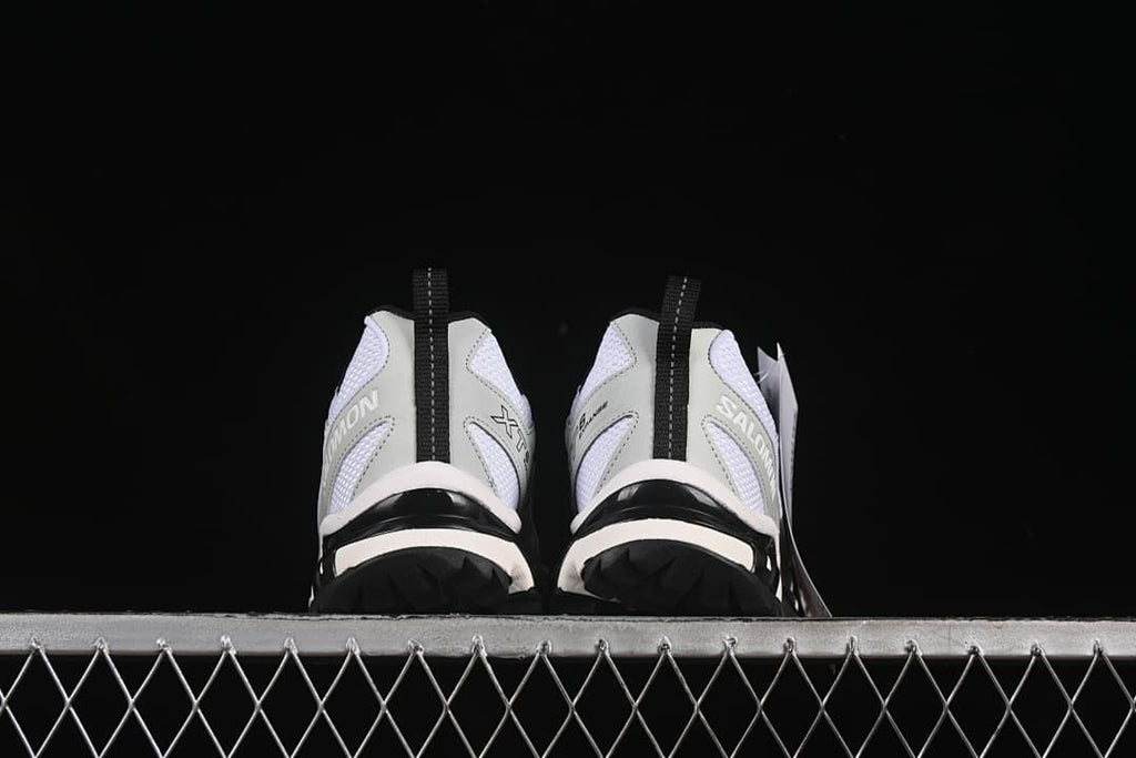 Rear view of the pair showing heel details and outsole edges.