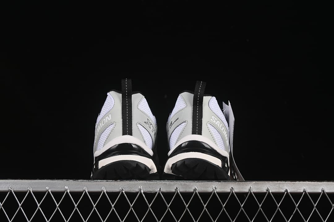 Rear view of the pair showing heel details and outsole edges.