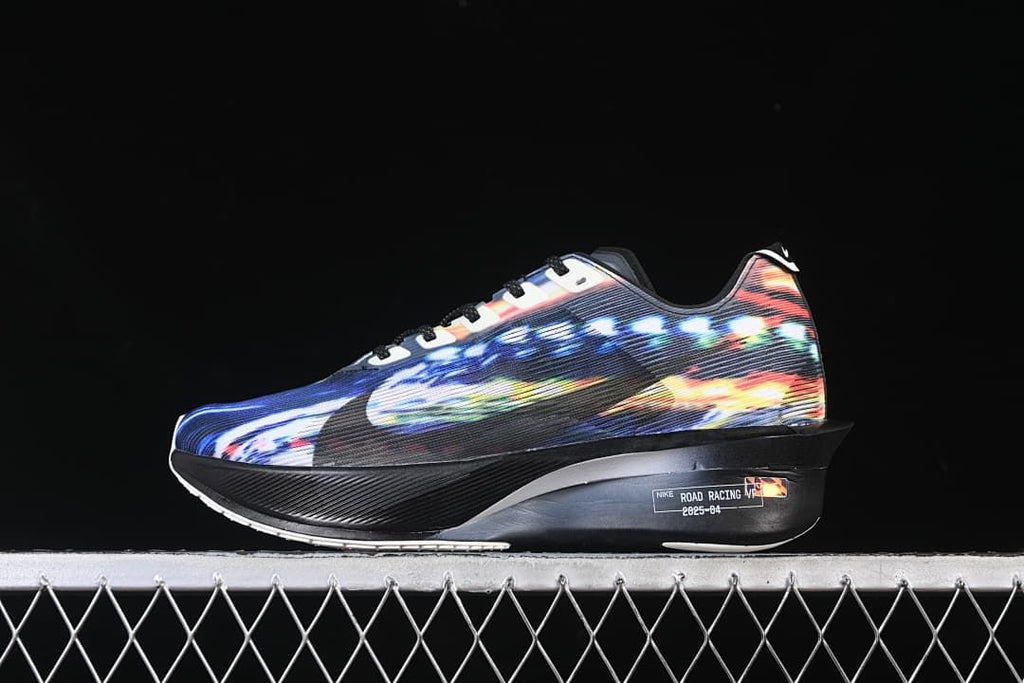 Side view of the multicolor shoe with black sculpted midsole