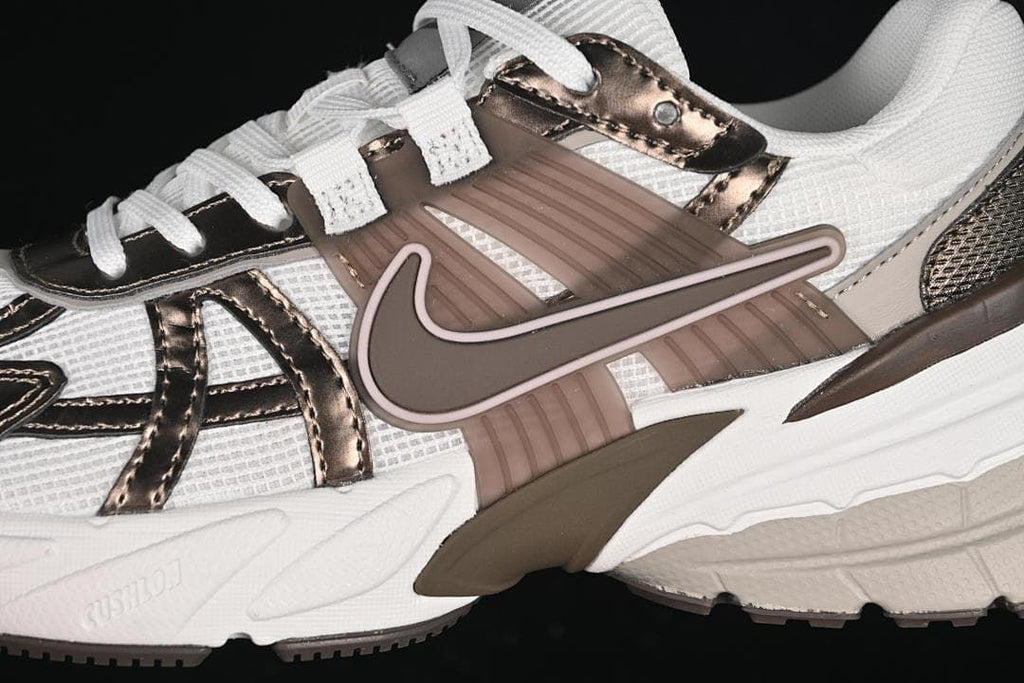 Close-up of the side overlays, Swoosh, and sole