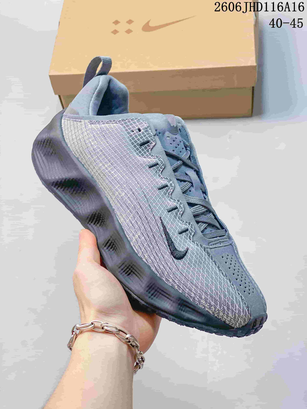 Angled side view of a gray Nike Ava Rover Hs shoe
