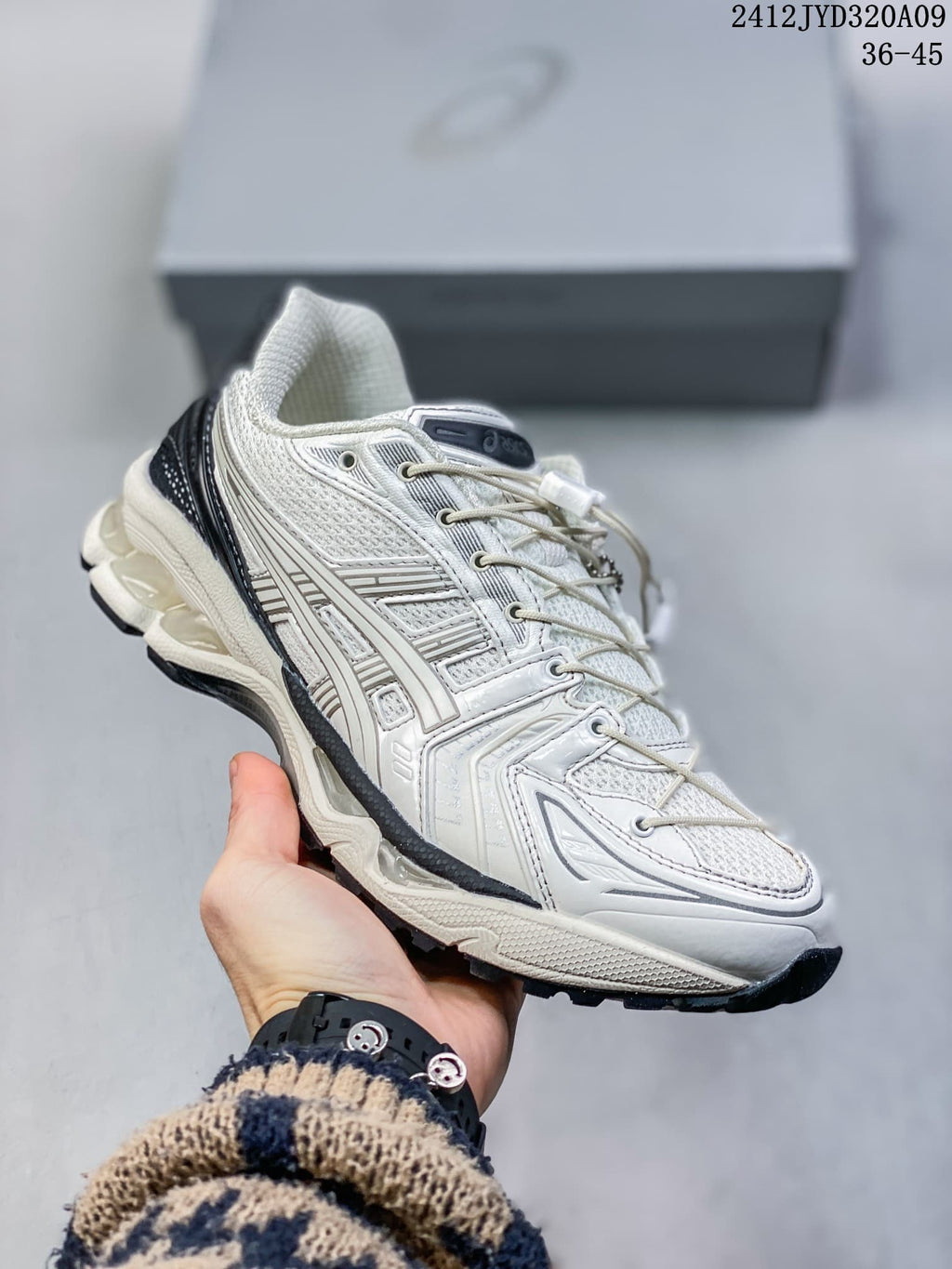 Side profile of the ASICS GEL-KAYANO 14 sneaker with its layered upper and outsole.