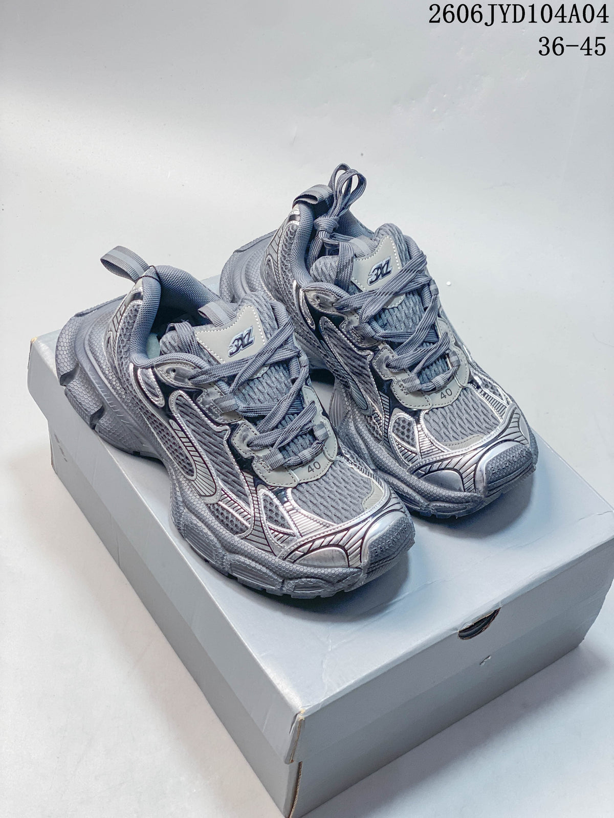 Pair of metallic gray Balenciaga 3XL sneakers shown on a box; image overlay states sizes 36–45.