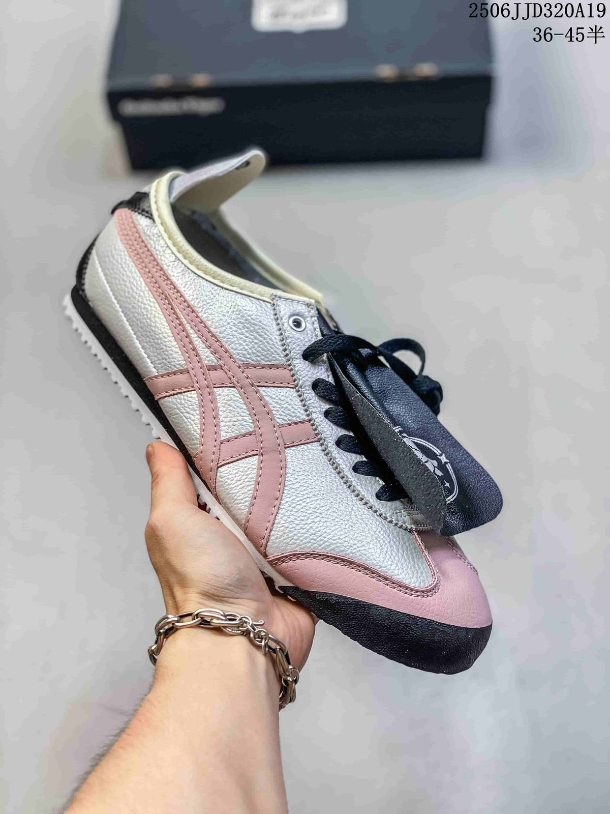 White low-top sneaker with pink accents, black laces and contrasting trim