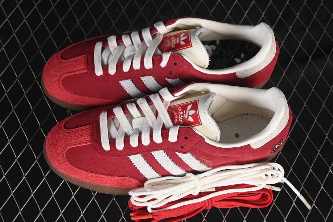 Pair of red and white sneakers with extra white and red laces