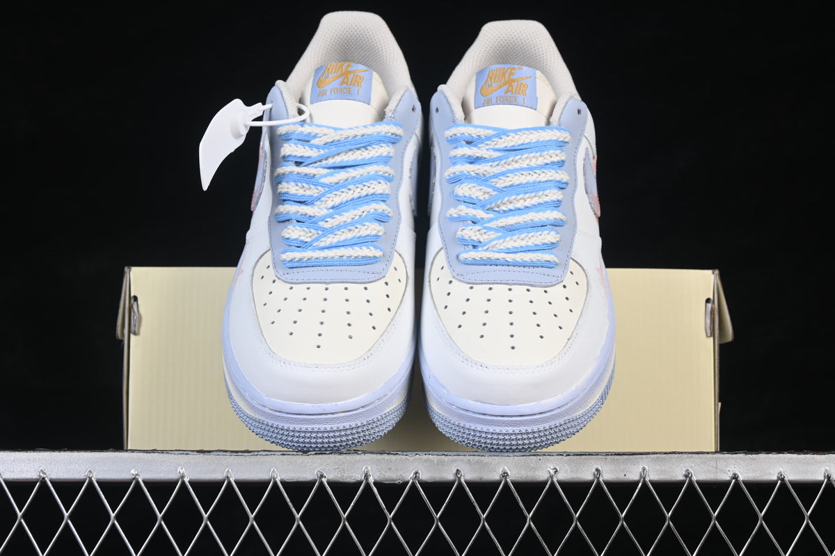 Front view of the pair showing perforated toe boxes and braided laces