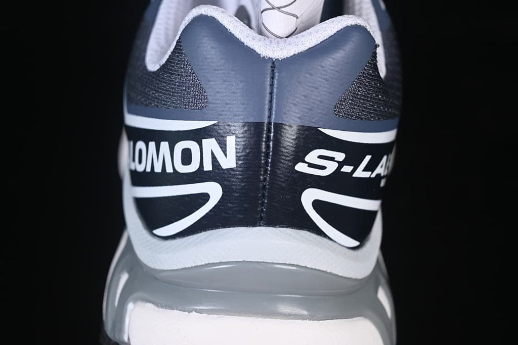Close-up of the navy and white heel branding
