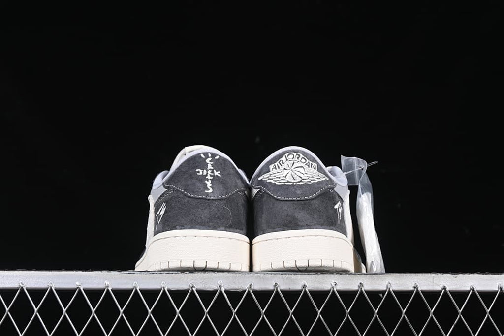 Rear view of both shoes with contrasting heel embroidery