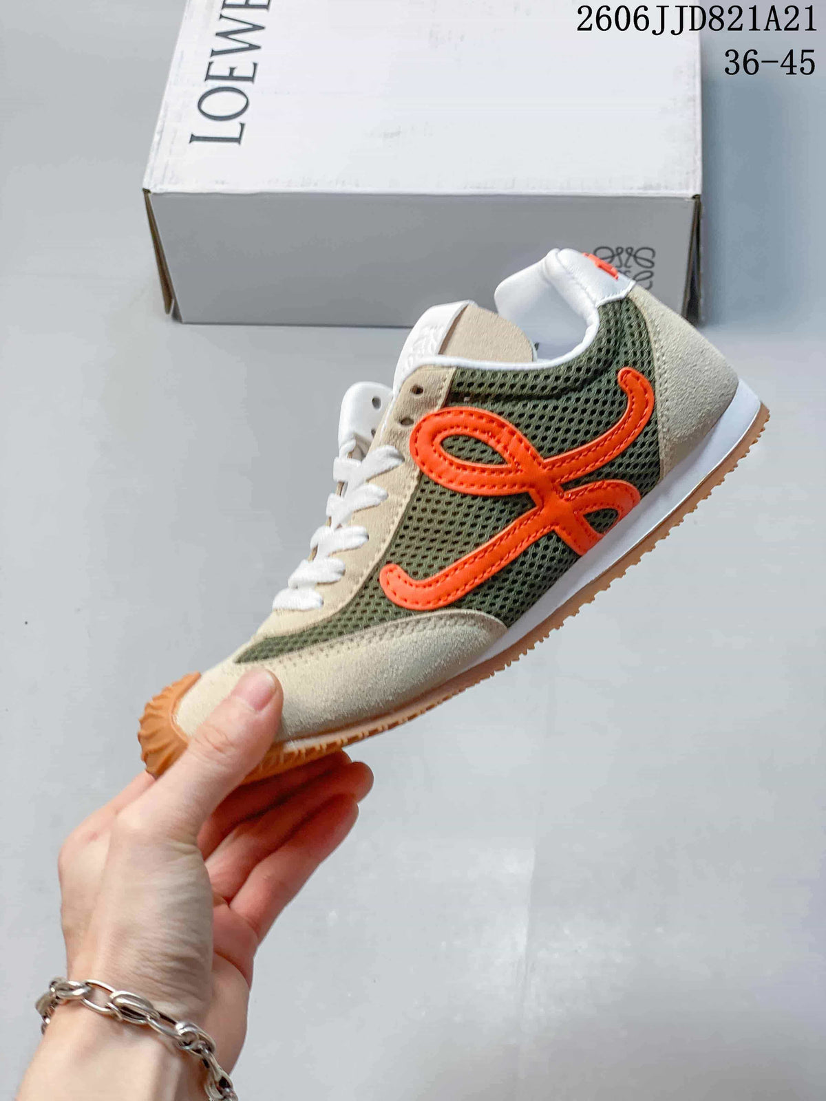 Side view of a sneaker with olive mesh panels and orange Loewe detailing