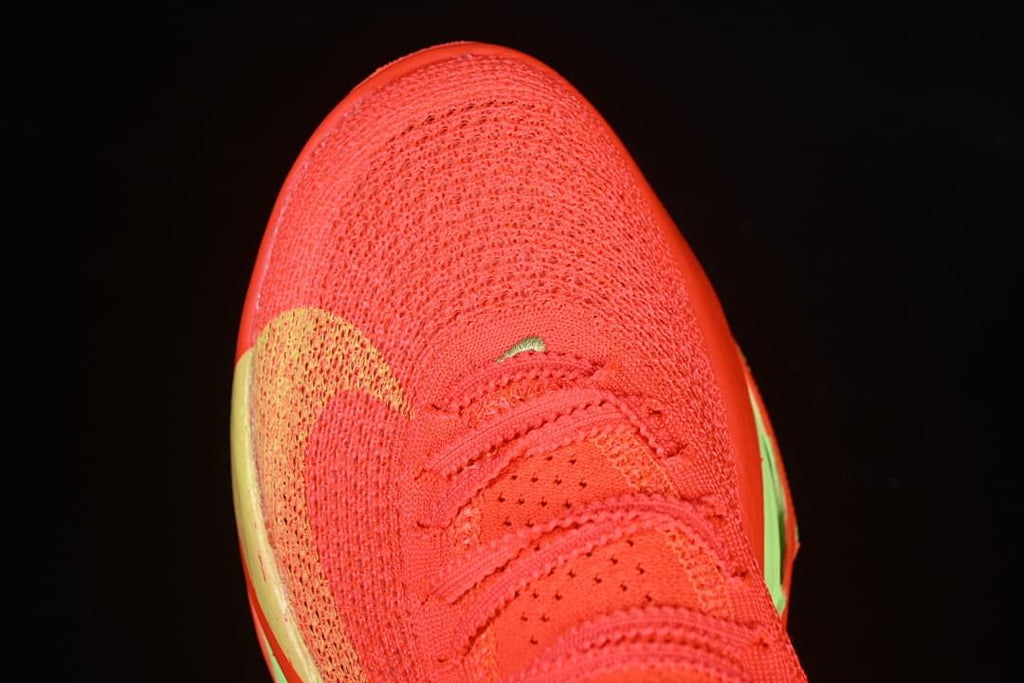 Top-down close-up of the shoe toe and perforated lace area