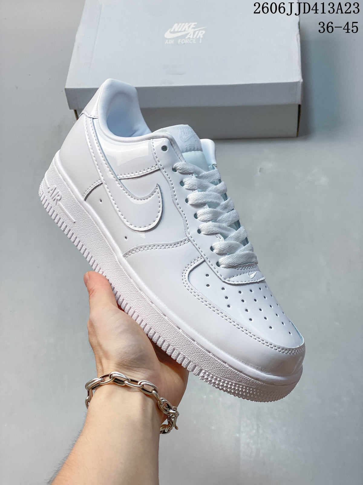 Angled side view of the white low-top sneaker