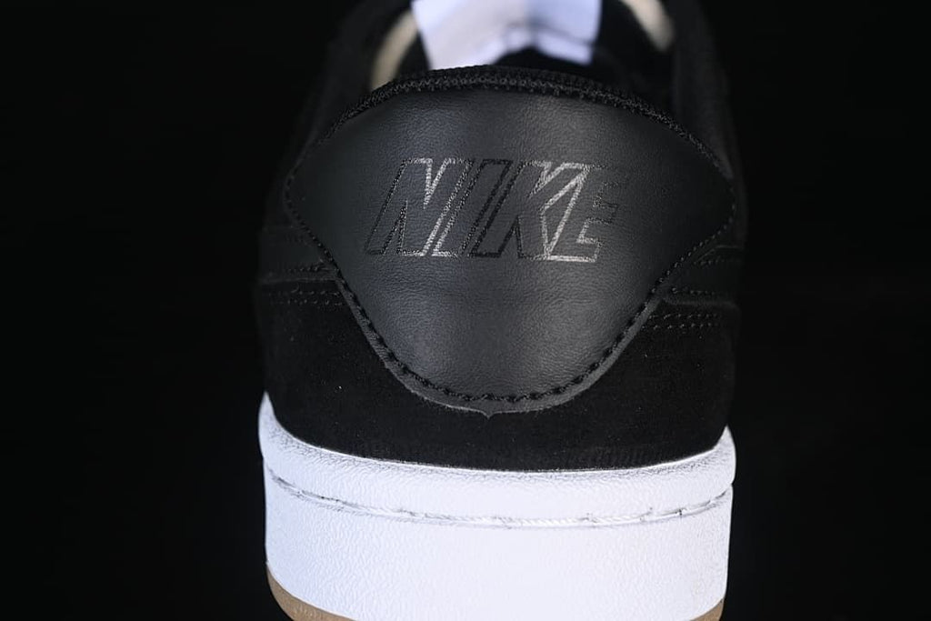 Close-up of the black heel panel and embossed Nike lettering.