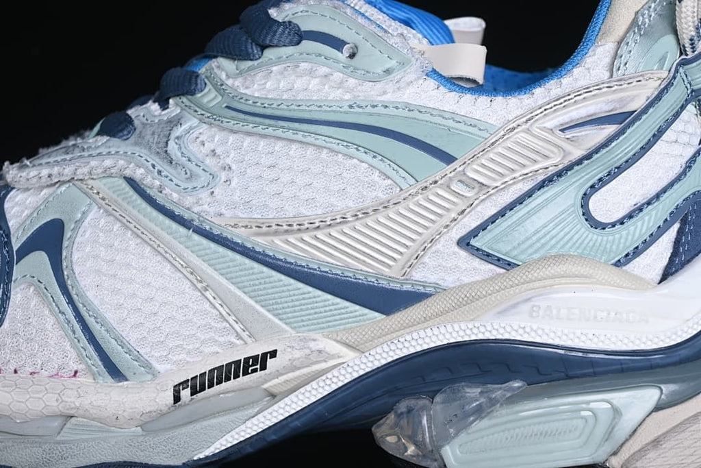 Close-up of the sneaker side showing textured panels and layered overlays