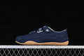 Side view of a navy adidas Urban Reverie sneaker with striped hook-and-loop straps and a gum-colored sole.
