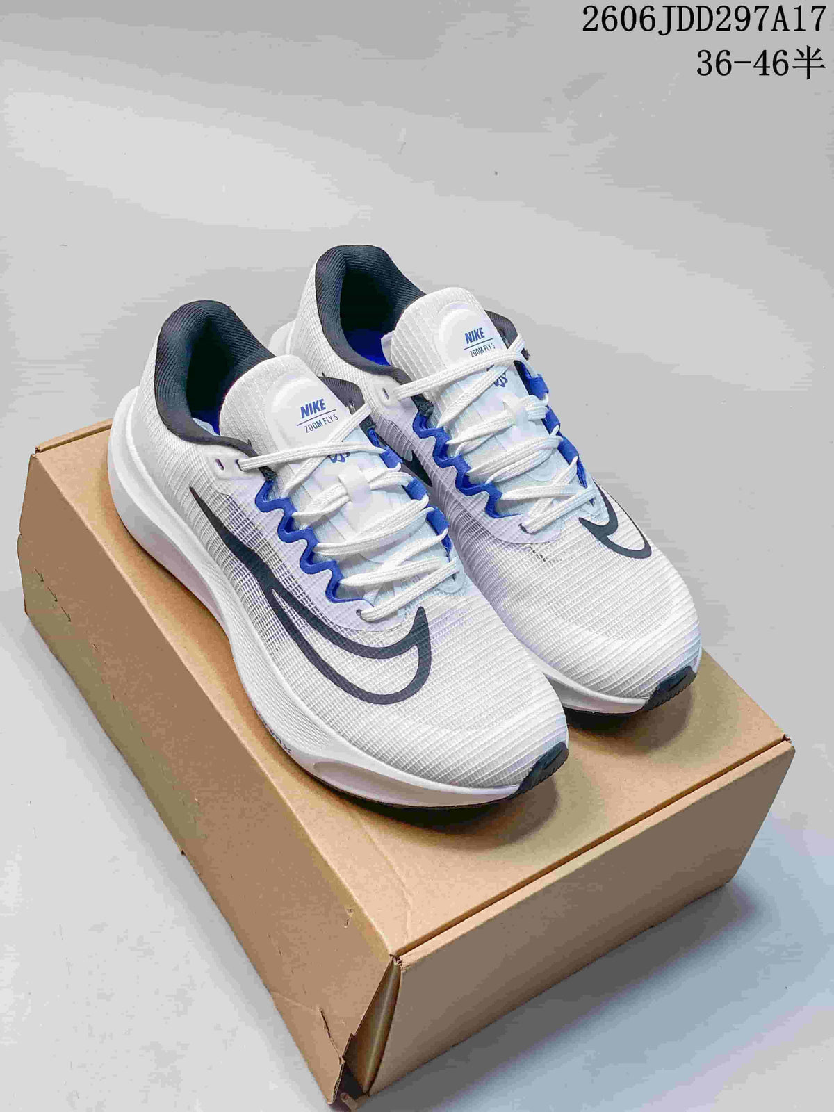 Pair of white Nike Zoom Fly 5 running shoes with blue and dark gray accents on a box.