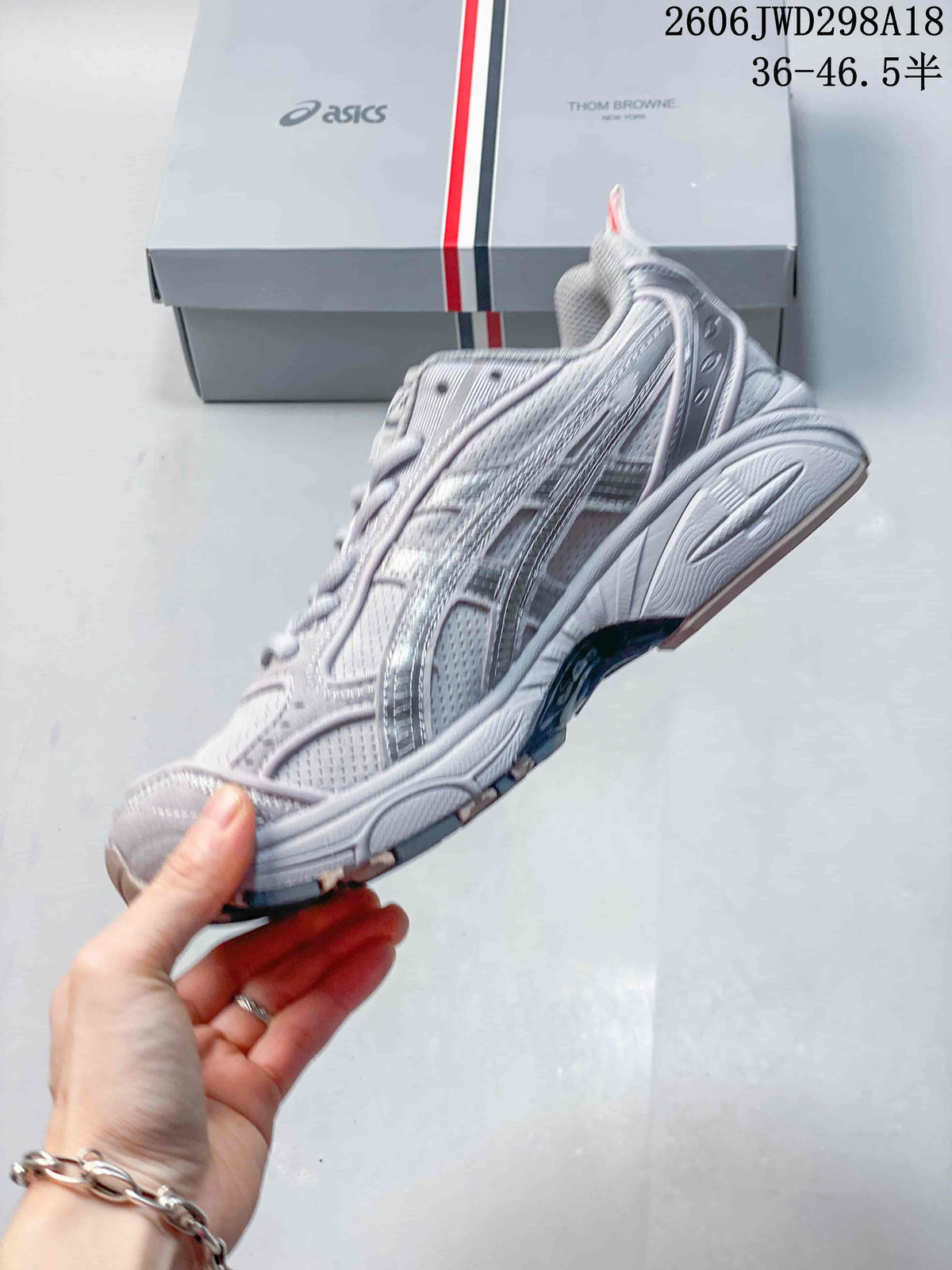 Side profile showing the layered upper and segmented sole.