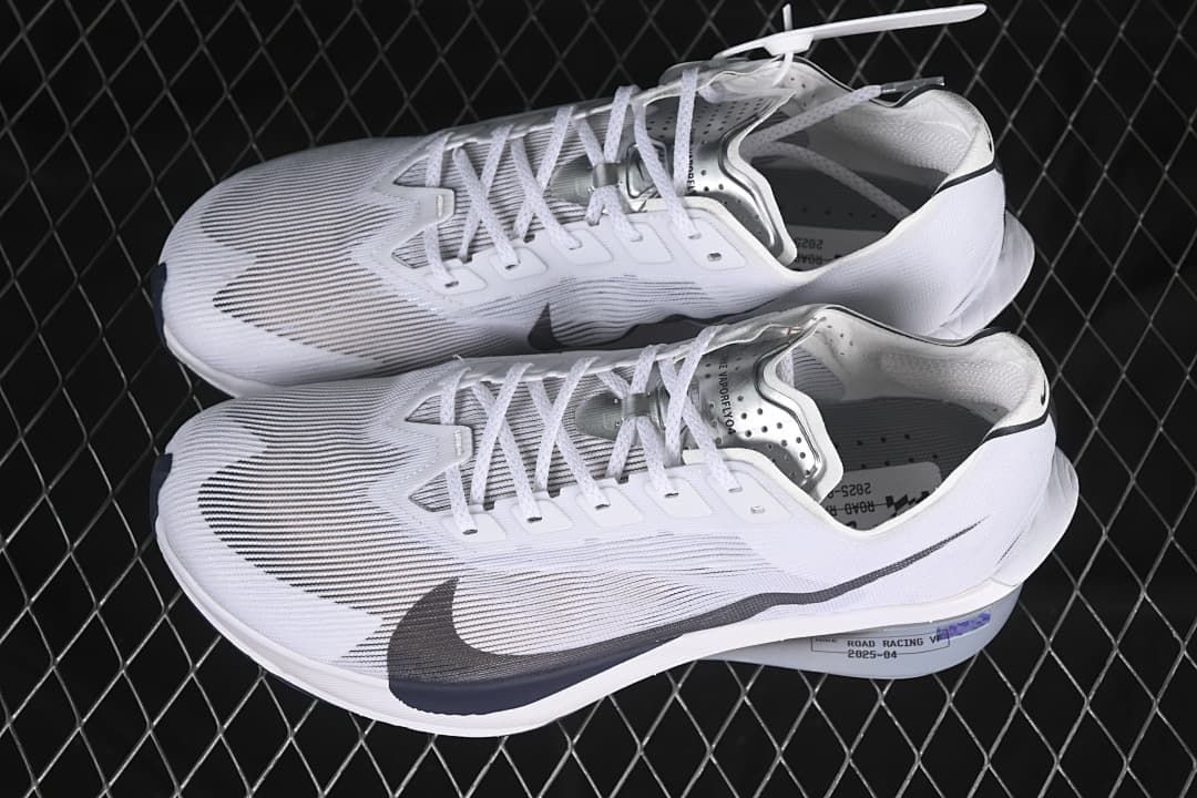 Pair of white Nike ZoomX Vaporfly NEXT% 4 shoes shown from above and the side.