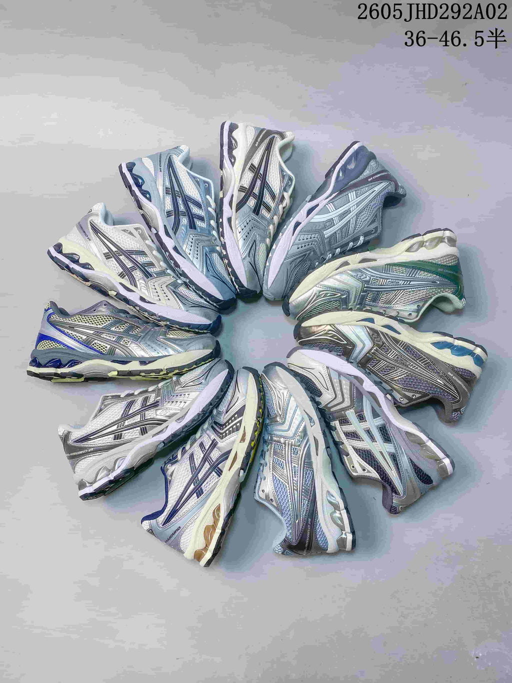 Several ASICS GEL-KAYANO 14 sneakers arranged in a circle, showing assorted color combinations