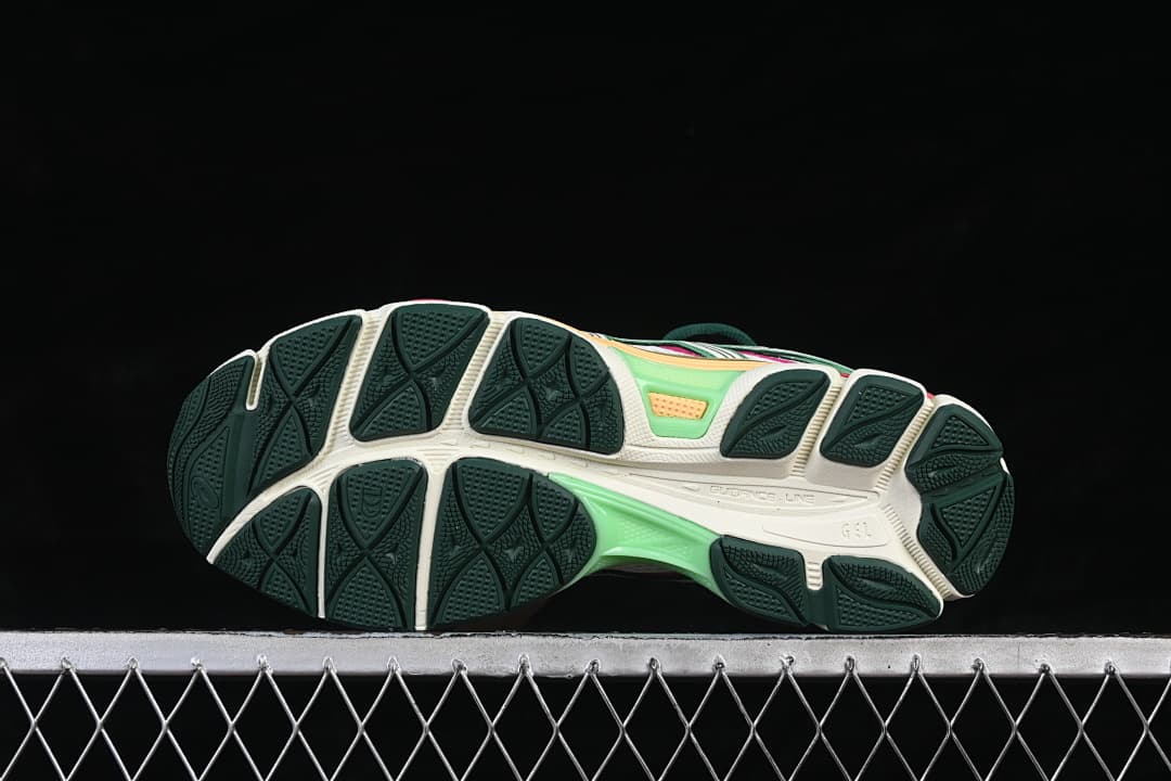 Underside view showing the patterned dark green outsole