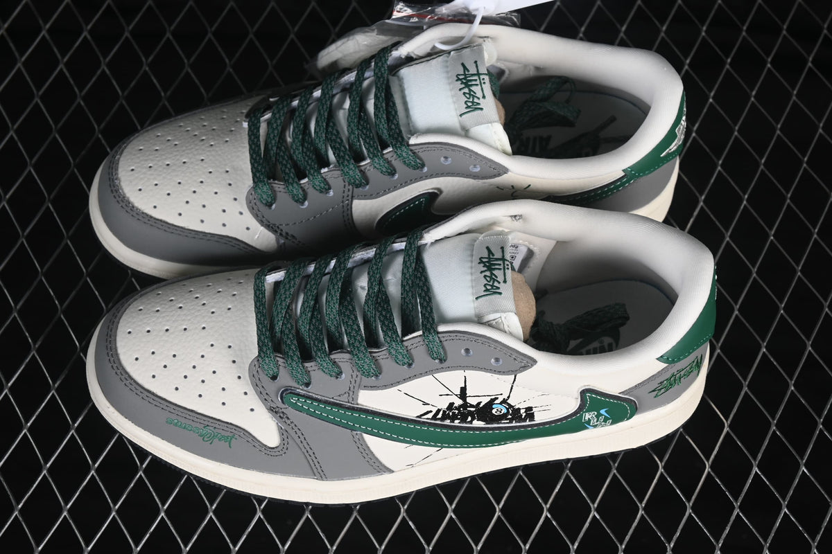 Pair of gray and off-white low-top sneakers with dark green laces and side accents.