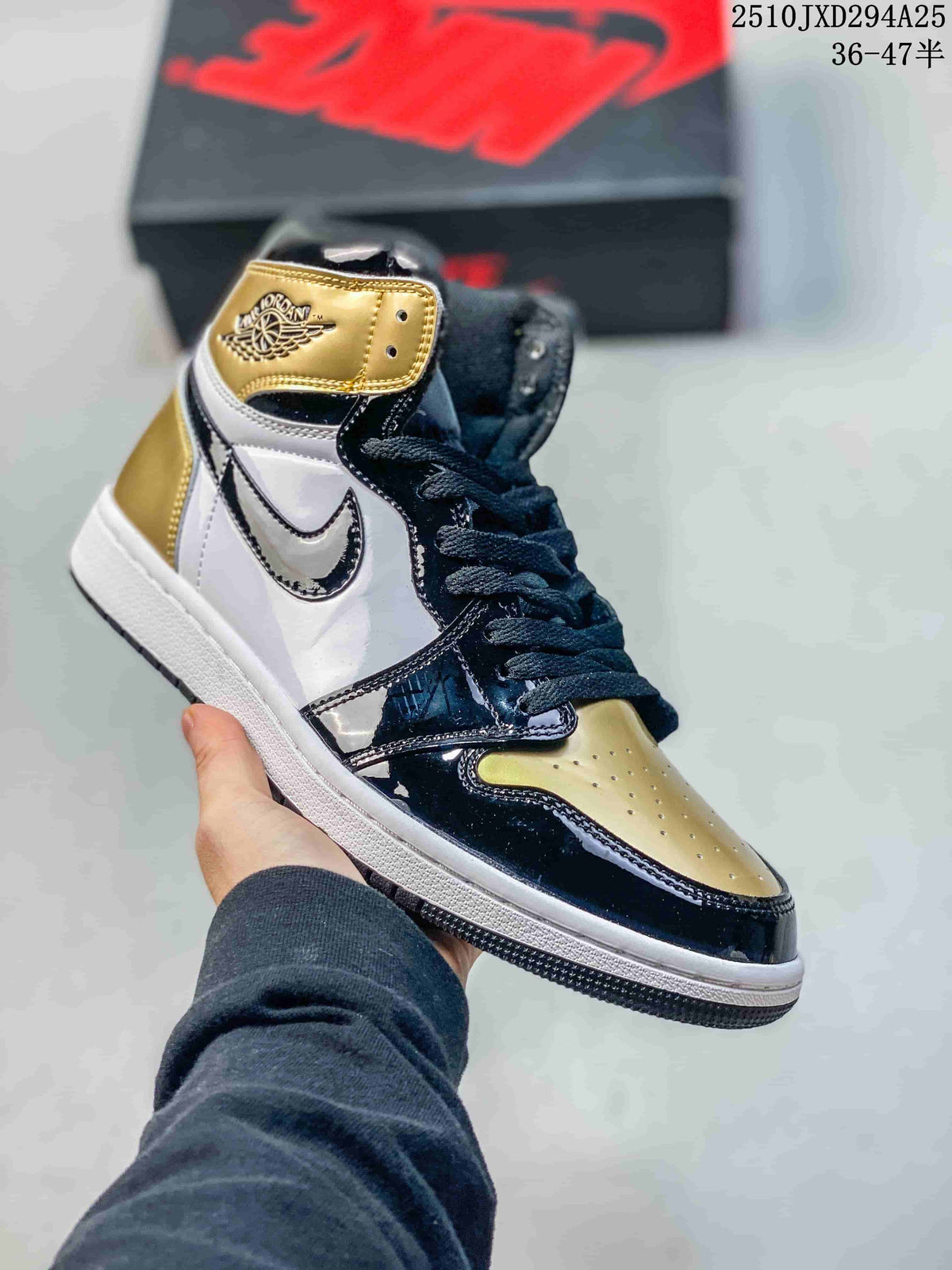 White, black, and gold high-top sneaker with glossy overlays
