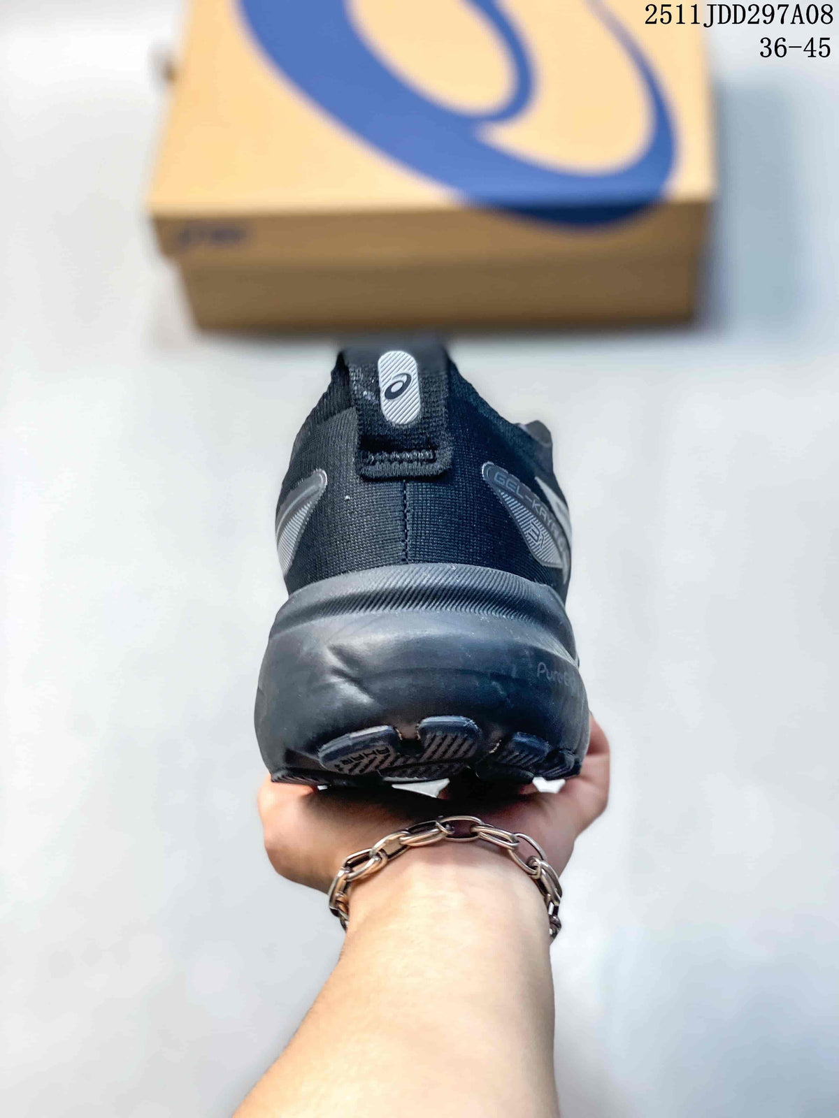 Rear view of a dark charcoal sneaker with GEL-KAYANO and PureGEL markings