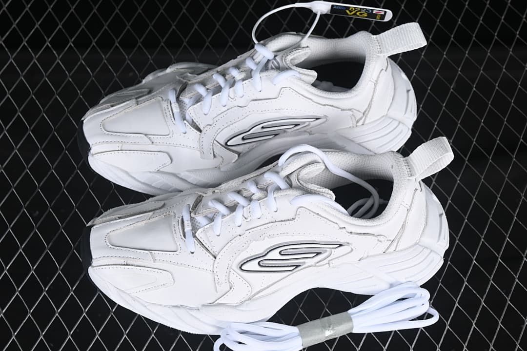 Pair of white low-top sneakers shown from above