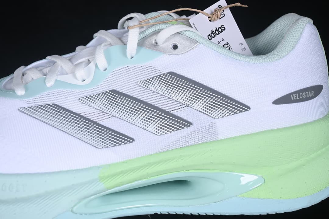 Side close-up showing silver stripes, Velostar label, and colored sole